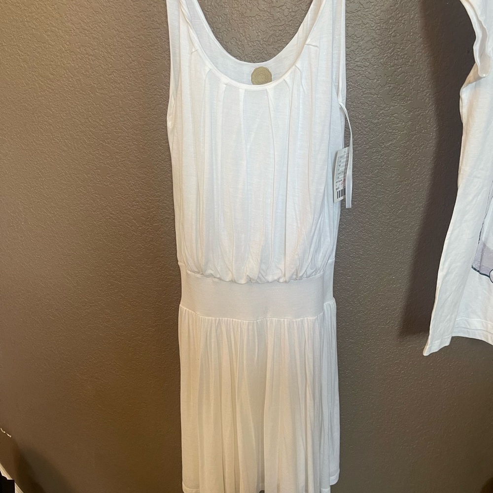 Anthropologie White Sleeveless Top with attached skirt. Cool for summer